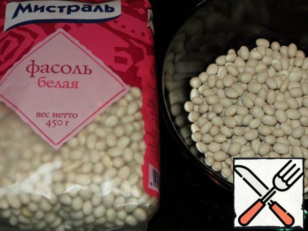Soak the beans for a few hours or overnight. Then drain the water, pour in fresh water and cook as indicated on the package. At the end of cooking, add salt.