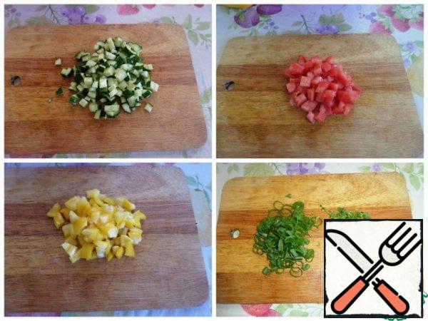 Cut the vegetables into cubes. Finely chop the greens.