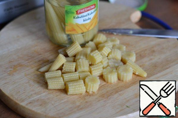 Mini corn cobs cut into three pieces.