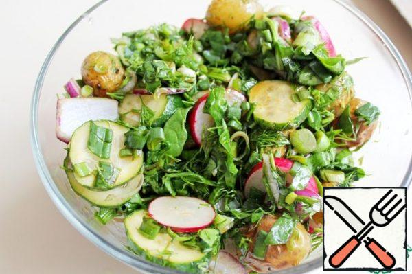 Combine all the vegetables and herbs, season with salad dressing, mix and serve immediately.
