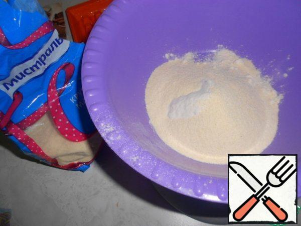 Combine the bulk products in a bowl-flour, semolina, baking powder, salt, and mix.