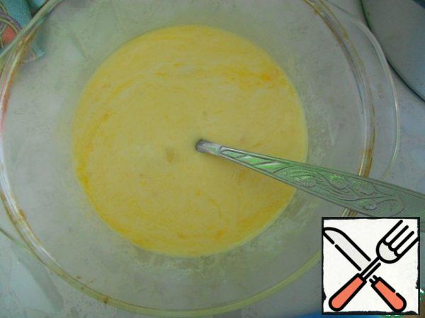Add the curdled milk and egg to the butter and mix gently.