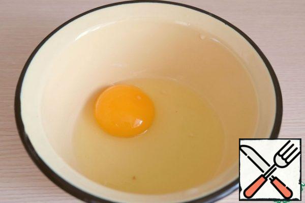 In a bowl, add 1 egg.