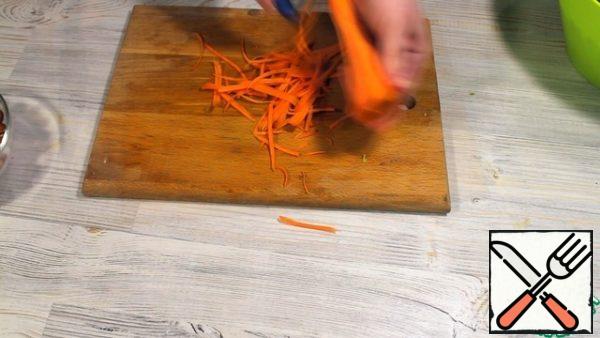 Cut the carrots into strips