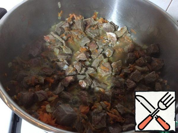 Fill the meat with water. The water should completely cover the meat. Simmer the dish for another 15 minutes.