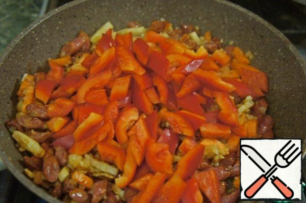 Next, add the garlic, onion, hot spices, whatever you want, paprika and pepper. Mix everything together.