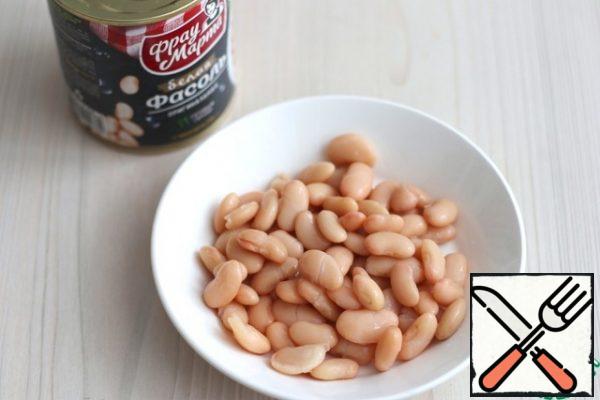 Wash the white beans (2 tablespoons) to remove the preservative-filling.