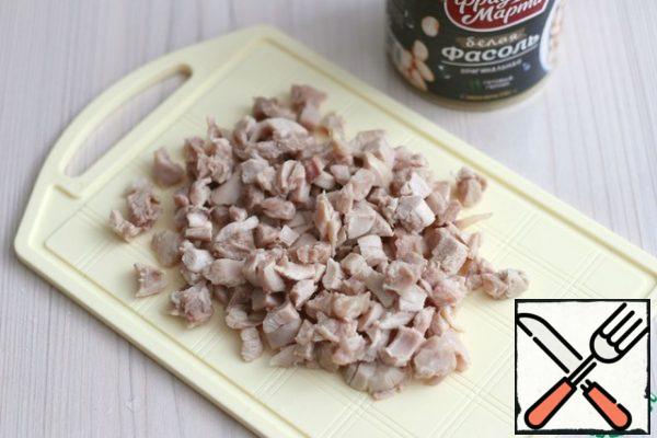 Chicken leg fillet boil in salted water, cut into small cubes/pieces.