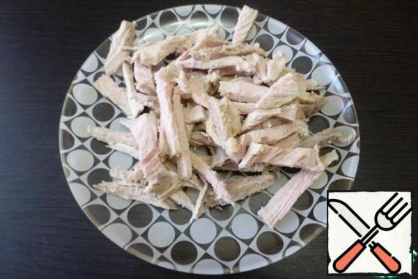 Boiled cooled pork cut into strips.