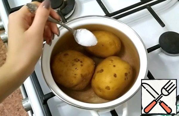 Wash the potatoes thoroughly. Cook over low heat with a small boil until almost ready.