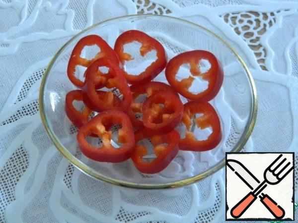 Hot pepper from the tip without seeds, thinly cut into circles.
