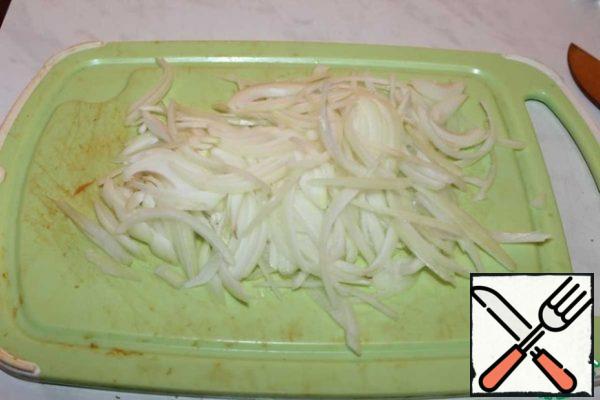 Two heads of onions are cut with feathers.