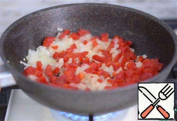 Add diced bell pepper to the onion.