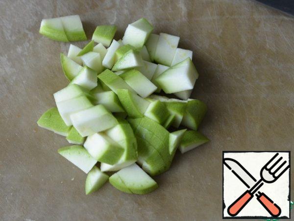 Zucchini cut into cubes. Put the vegetables in the pan. Fry for 5 minutes.