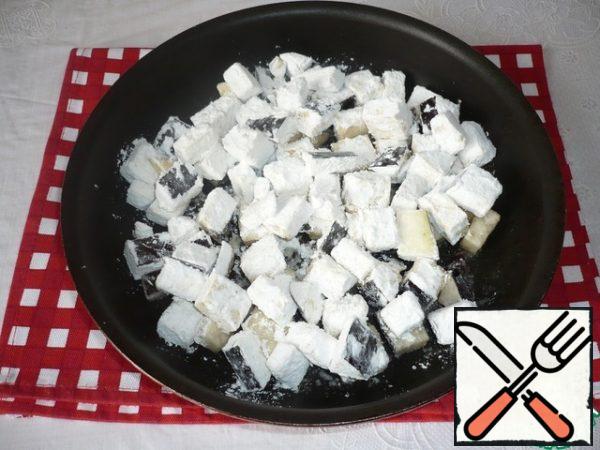 Heat the vegetable oil in a frying pan and fry the eggplant cubes over high heat for 5-7 minutes, add salt and pepper to taste.