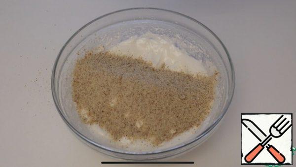 Pour the almond crumbs into the Meringue and mix gently