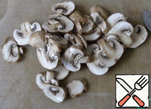 Mushrooms are washed, dried, cut into plates.