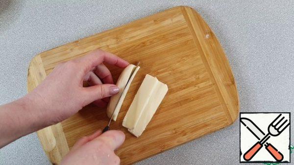 Cut the cheese into thin plates
