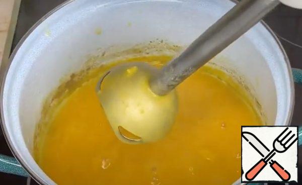 When the vegetables are soft, whisk in the cream with an immersion blender.