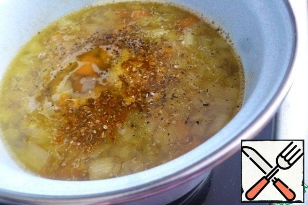 Mash the cumin and coriander lightly. Add spices to the soup. Add salt and pepper to taste.