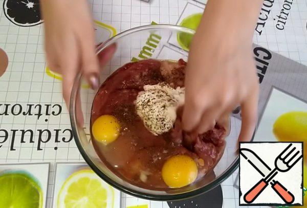 Add sour cream, 2-3 eggs, brandy, salt to taste, ground black pepper.
Mix everything well.