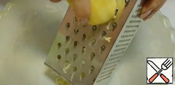 Grate the potatoes on a coarse grater.