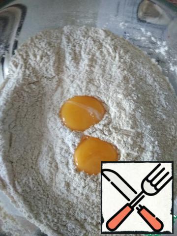 Combine flour with baking powder, salt and sugar.
Add the egg yolks and...