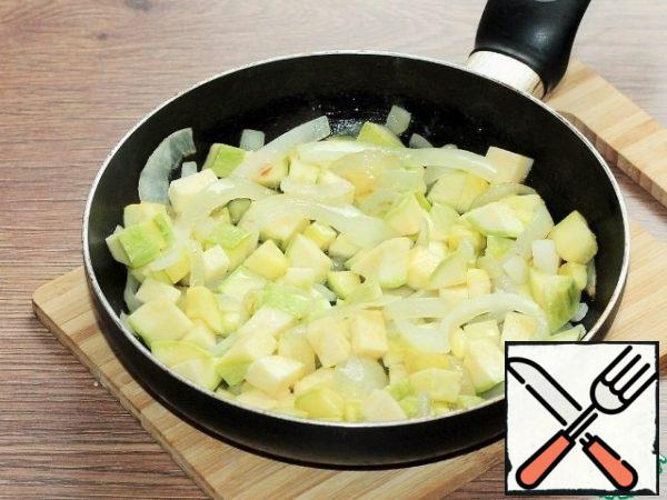Add the diced zucchini to the onion...