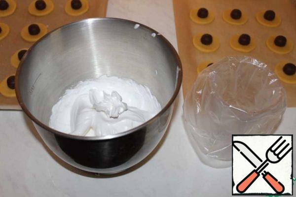 Transfer the meringue to a pastry bag.