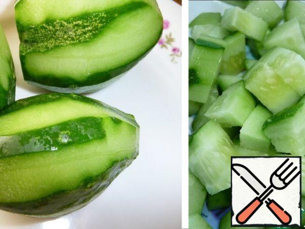 Cucumbers are peeled and coarsely chopped.