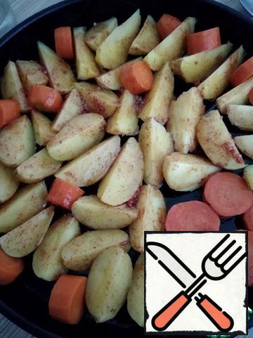 Hot potatoes and carrots are cut into slices, placed on a baking sheet and coated with vegetable oil with spices. we send it to the oven preheated to 180-190 degrees for 40-50 minutes until the crust forms.