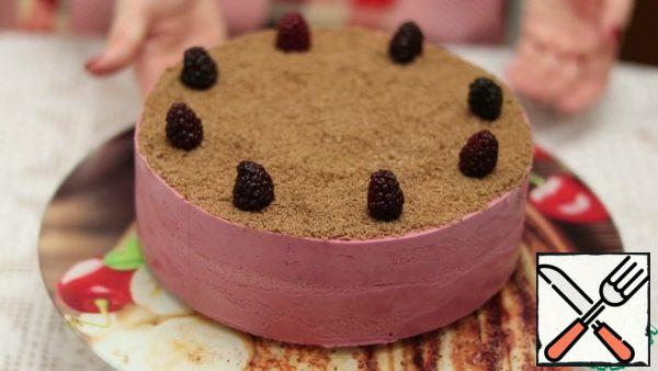Decorate the cake with the ground remains of the cake and berries.
Enjoy your meal.