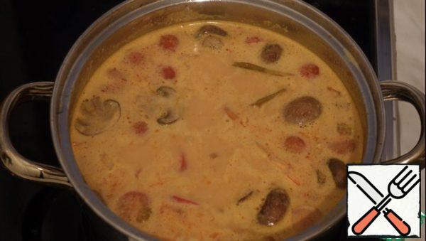 Pour coconut milk or cream and bring to a boil.