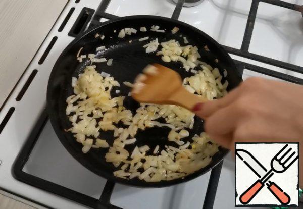 Fry the onion until golden brown.