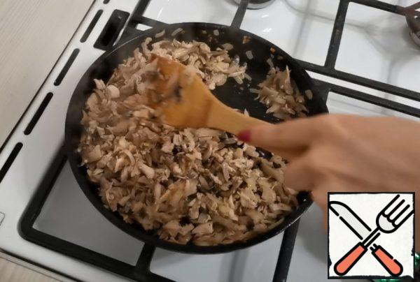 Then add the mushrooms and meat. Fry a little more.