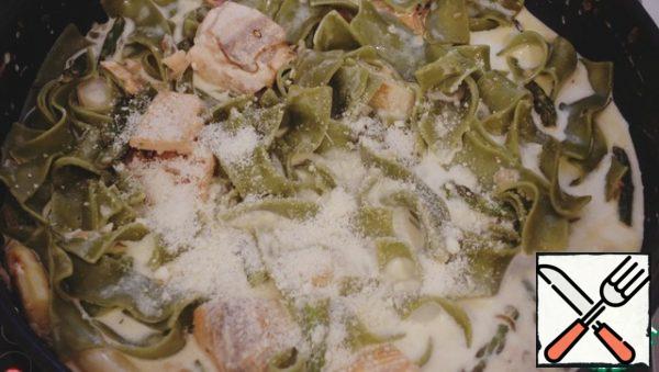 Pour the cream, add the parmesan, and simmer until slightly thick