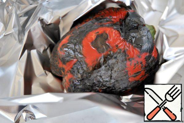 Cook the eggs, cool, peel and cut into four pieces. Pepper burn on an open flame and wrap in foil and leave for 5-10 minutes.