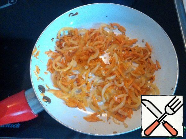 Fry the onion and carrot until golden brown.