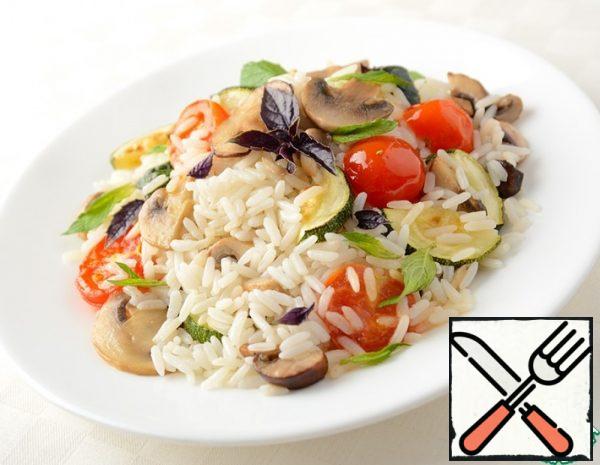 
Mix the vegetables and mushrooms lightly with the ready-made hot rice, garnish with herbs to taste.In the salad, you can add sauce to taste or sprinkle with lemon juice. Serve hot on the table as a salad or side dish.