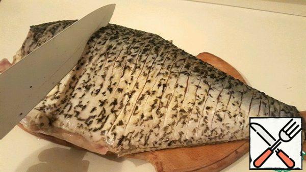 We take the fish and make incisions along the entire length