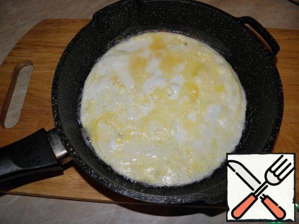 Make an omelet from 2 eggs, I add 3 more tbsp of milk to it (you can do it without).