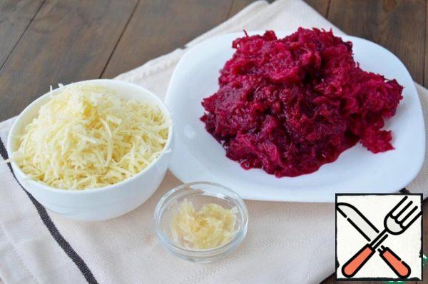 Grate the beets on a medium grater, put them on a sieve, let the juice drain, and grate the cheese and garlic.