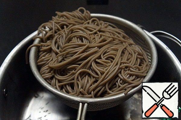 Toss the noodles in a colander.
