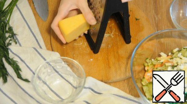 Finely chop the dill, grate the cheese on a coarse grater. Add the cheese and dill to the bowl with the salad, add a little salt. Mix everything well, fill it with mayonnaise before serving.