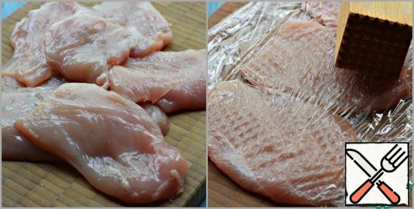 Chicken fillet (breast) cut in half lengthwise.
Lightly beat off each piece (through the food film).