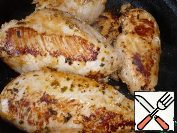 Turn the chicken fillet over.