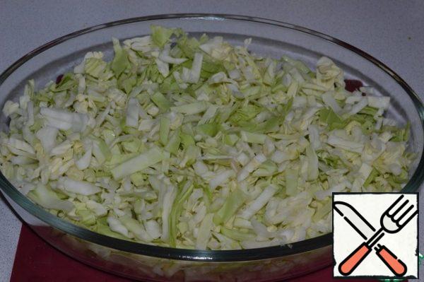 Chop the cabbage, put it in a baking dish.