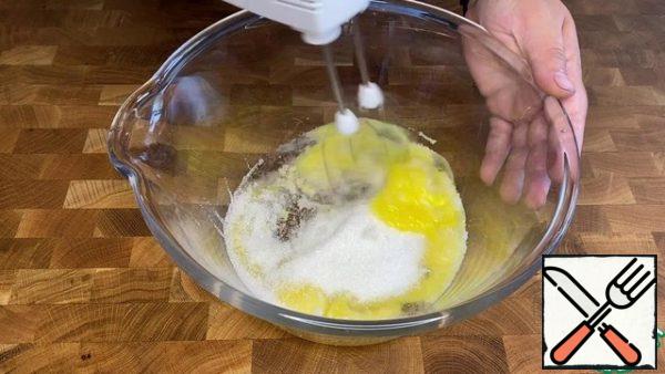 Beat the egg yolks with sugar (150 g).