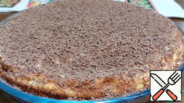 Carefully remove the parchment paper and sprinkle the cake liberally with grated chocolate. Cottage cheese pie "on the contrary" is ready! Bon Appetit!