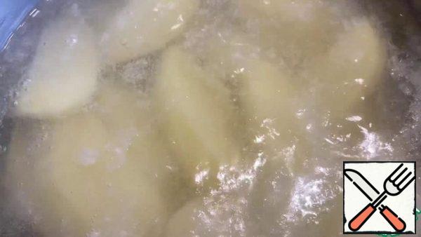 Peel the potatoes and boil them in salted water.